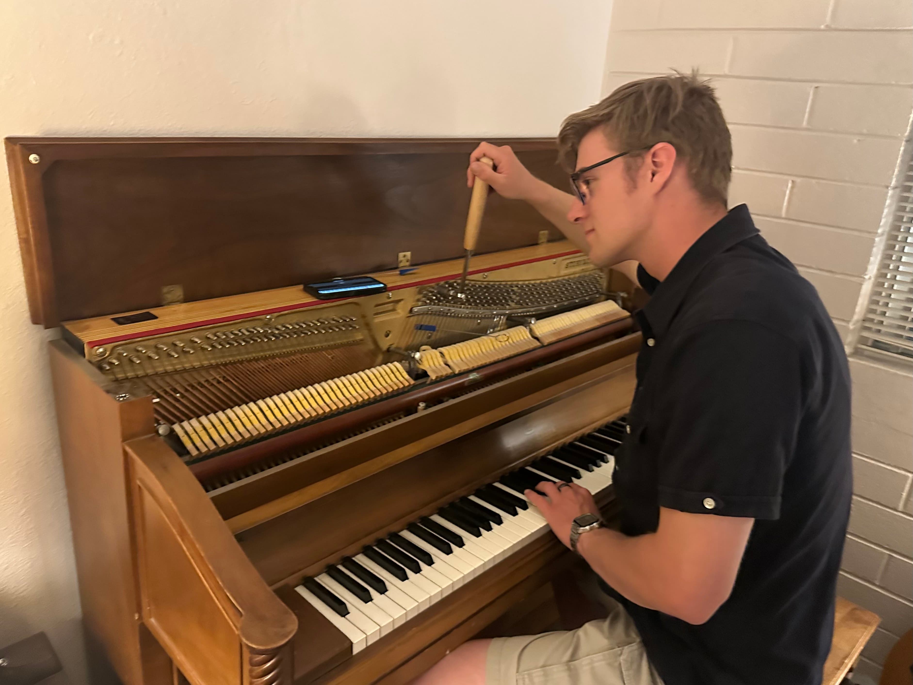 Chris tuning a piano